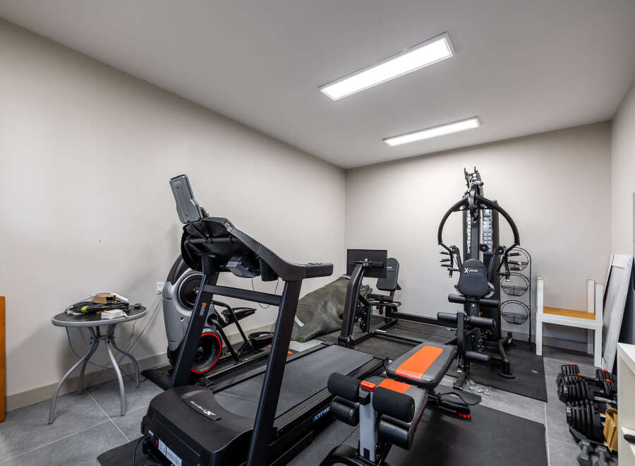 Transform your home into a personal fitness sanctuary with this fully equipped home gym.