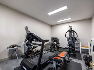 Transform your home into a personal fitness sanctuary with this fully equipped home gym.
