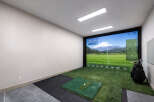 Experience the ultimate in home entertainment with this state-of-the-art indoor golf simulator.