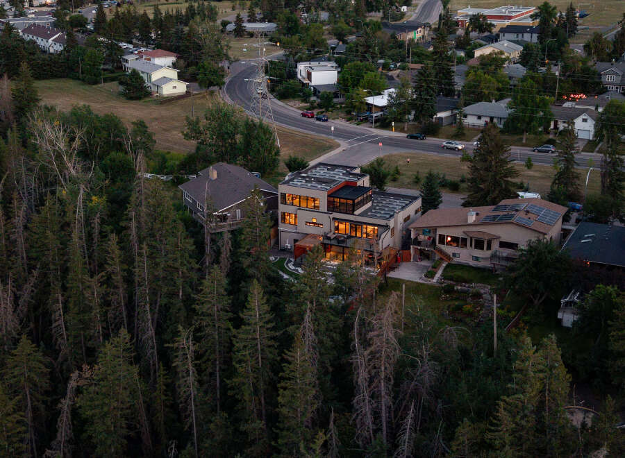 Nestled amidst a lush forest, this modern architectural gem offers unparalleled luxury and privacy.