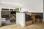 Experience modern living in this beautifully designed space, featuring a sleek fireplace and entertainment center.