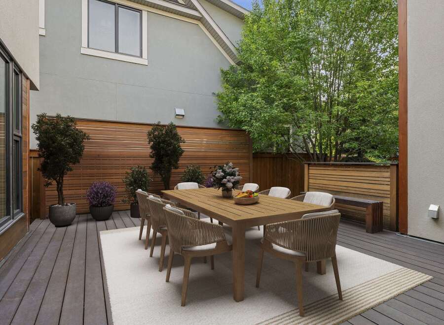 Enjoy al fresco dining on this spacious deck, perfect for entertaining.