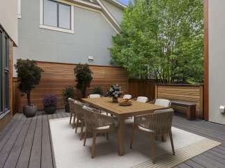 Enjoy al fresco dining on this spacious deck, perfect for entertaining.
