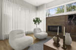 Experience modern living in this stylish living room, featuring two plush armchairs perfect for relaxation.