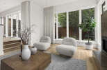 Experience modern living in this bright and airy living space, featuring plush boucle armchairs perfect for relaxation.