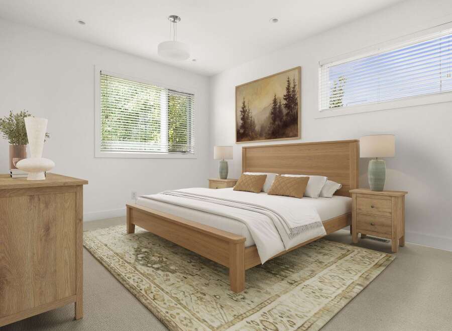 This beautifully staged bedroom features a warm, natural wood bed frame and matching nightstands, creating a cozy and inviting atmosphere.