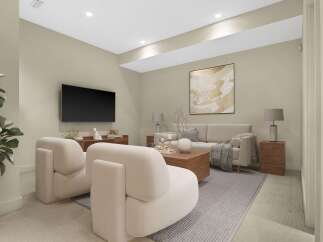 Experience modern living in this beautifully staged living room, featuring plush cream armchairs and a comfortable sofa perfect for relaxation.