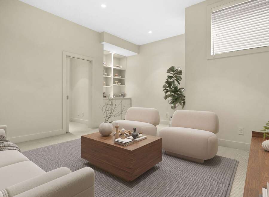 Step into this inviting living space, featuring a plush sectional sofa and two comfortable armchairs perfect for relaxation.