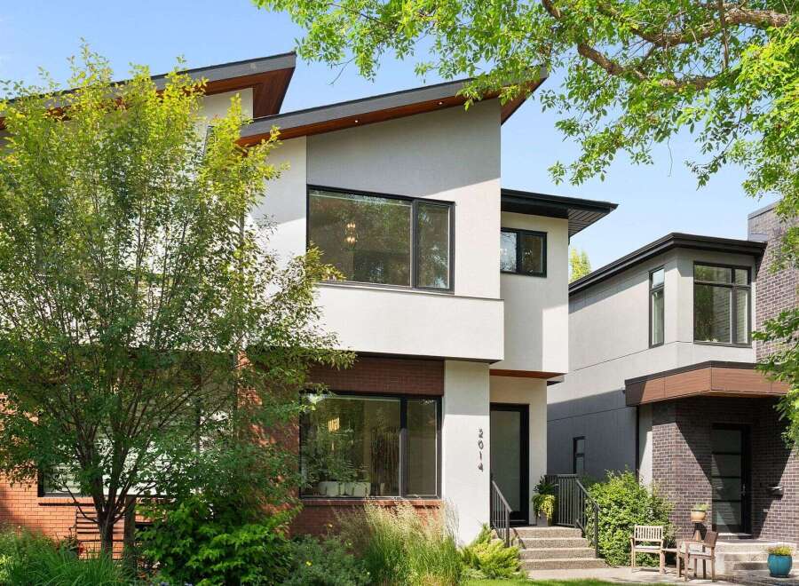 Discover modern living in this stunning architectural gem, featuring a striking asymmetrical roofline and expansive windows that flood the interior with natural light.