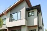 Experience modern living in this stunning home featuring a sleek stucco exterior and striking architectural lines.
