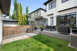 Experience modern luxury in this stunning backyard oasis, featuring a spacious deck perfect for entertaining.