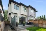 Experience modern luxury in this stunning home featuring a spacious backyard deck perfect for entertaining.