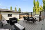 Enjoy outdoor living at its finest on this spacious deck, perfect for entertaining.