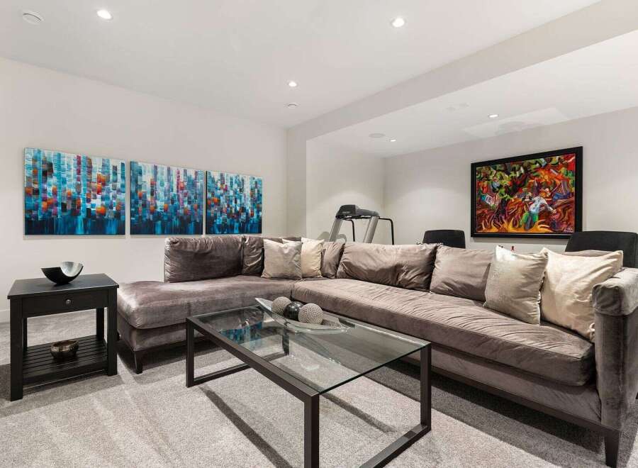 This modern living room features a plush, oversized sectional sofa perfect for relaxation and entertaining.