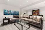 This modern living room features a plush, oversized sectional sofa perfect for relaxation and entertaining.