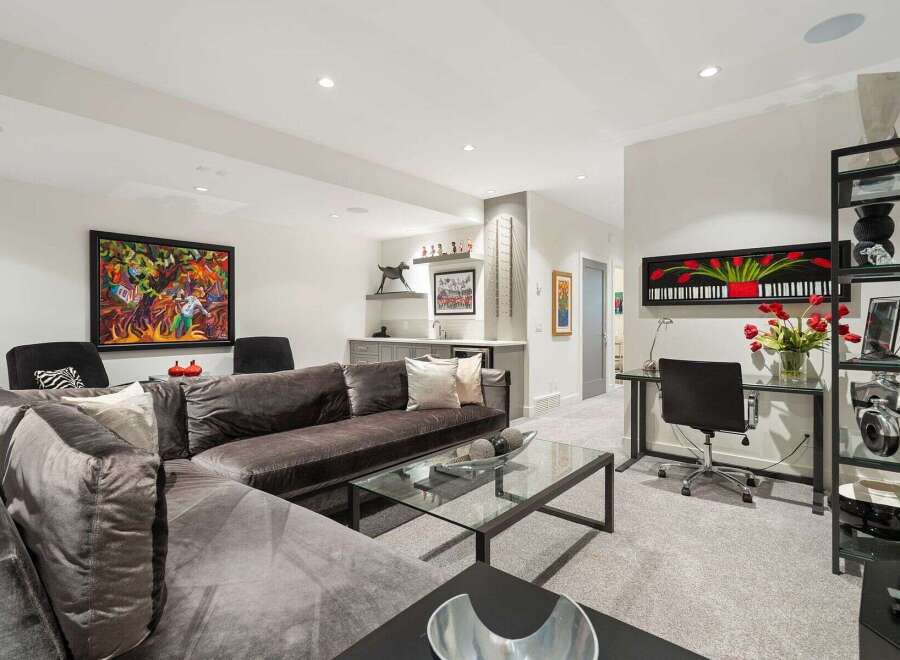 This sophisticated living space features a plush, oversized sectional sofa perfect for relaxation and entertaining.