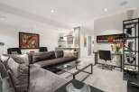 This sophisticated living space features a plush, oversized sectional sofa perfect for relaxation and entertaining.
