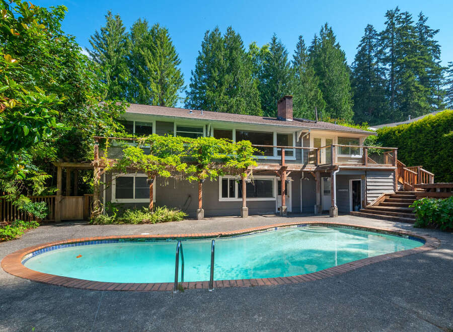 Enjoy outdoor living with this stunning property featuring a sparkling swimming pool perfect for hot summer days.