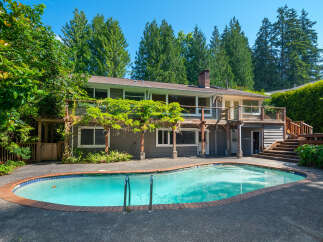 Enjoy outdoor living with this stunning property featuring a sparkling swimming pool perfect for hot summer days.