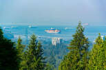 Experience breathtaking panoramic views from this stunning property, overlooking the majestic Lions Gate Bridge and the bustling Vancouver harbor.