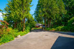 Nestled amidst lush greenery and mature trees, this property offers a serene and private retreat.