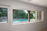 Enjoy your own private oasis with this stunning backyard featuring a sparkling swimming pool and a relaxing hot tub.