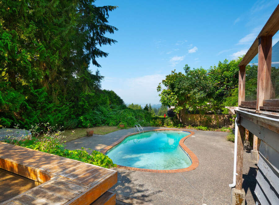 Escape to your private oasis with this stunning kidney-shaped swimming pool, perfect for summer relaxation and entertaining.