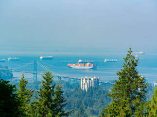 Experience breathtaking panoramic views from this prime real estate location, overlooking the Lions Gate Bridge and the bustling Vancouver harbor.