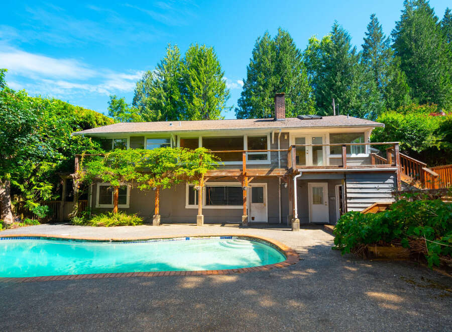 Escape to this stunning home featuring a sparkling swimming pool, perfect for hot summer days.