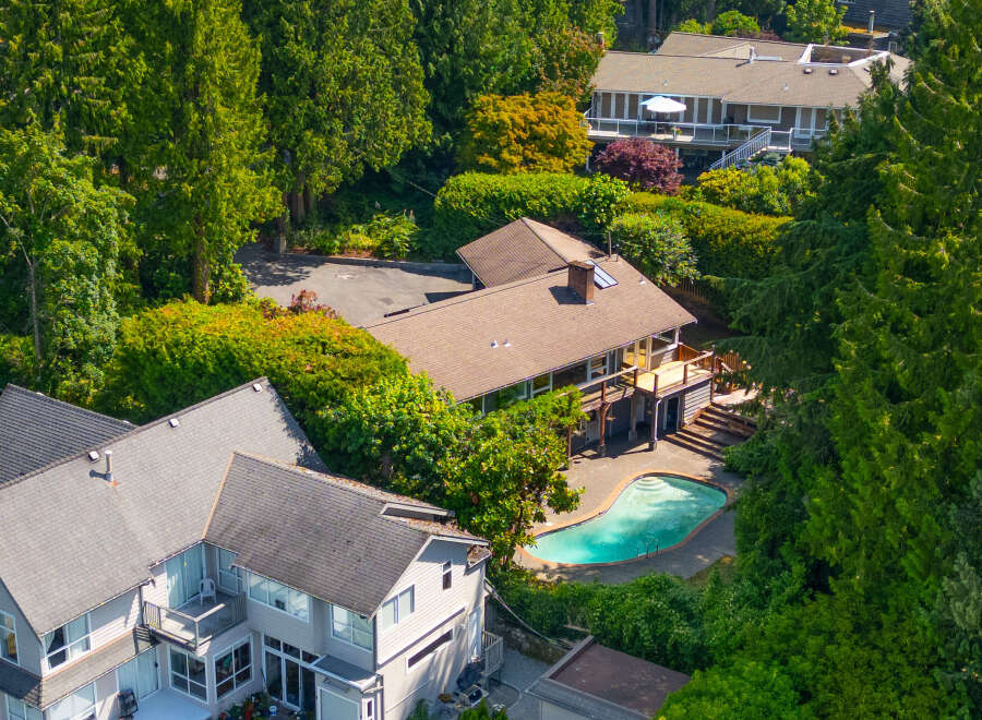Experience luxury living with this stunning property featuring a private, kidney-shaped swimming pool perfect for relaxation and entertainment.