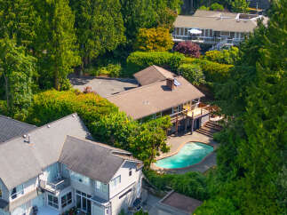 Experience luxury living with this stunning property featuring a private, kidney-shaped swimming pool perfect for relaxation and entertainment.