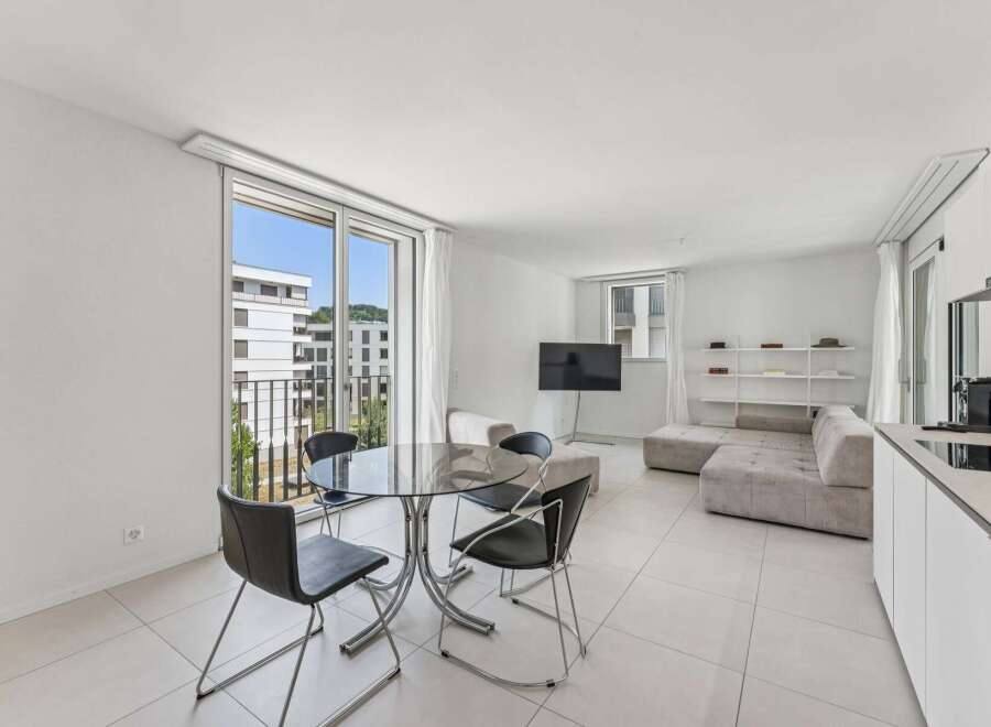 Experience modern living in this bright and airy apartment, featuring a spacious open-plan living area perfect for relaxation and entertaining.