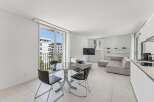 Experience modern living in this bright and airy apartment, featuring a spacious open-plan living area perfect for relaxation and entertaining.