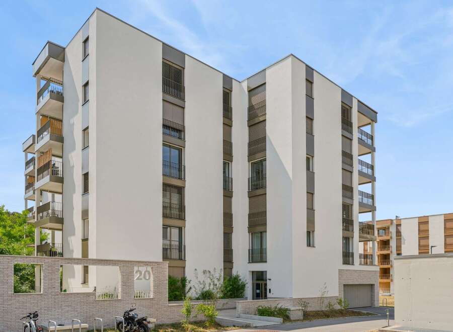 Discover modern living in this stunning apartment building, featuring sleek architecture and spacious balconies perfect for enjoying the outdoors.