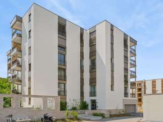 Discover modern living in this stunning apartment building, featuring sleek architecture and spacious balconies perfect for enjoying the outdoors.