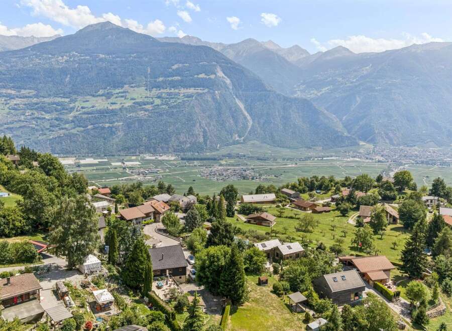 Nestled amidst rolling green hills and offering breathtaking panoramic views of the majestic mountains and valley below, this charming property presents an idyllic retreat.