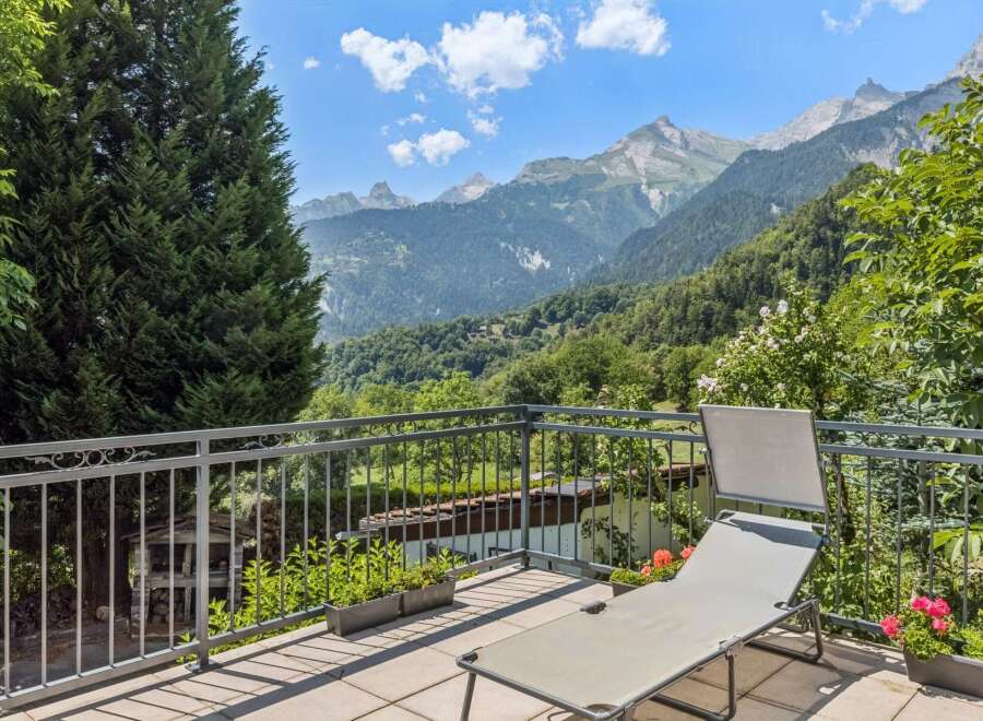 Enjoy breathtaking mountain views from this stunning balcony, perfect for relaxation and outdoor living.