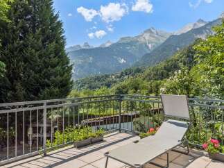 Enjoy breathtaking mountain views from this stunning balcony, perfect for relaxation and outdoor living.