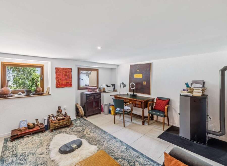 Discover this versatile room, perfect for a home office or a tranquil meditation space.