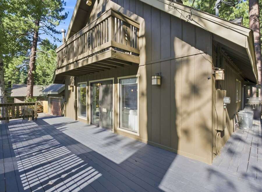 Experience the charm of this mountain retreat, featuring a spacious multi-level deck perfect for outdoor living and entertaining.