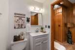 This charming bathroom features a whimsical bear-themed decor, including a playful wall art and a unique tissue box holder.