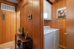 Discover a charming interior featuring warm wood paneling throughout, creating a cozy and inviting atmosphere.