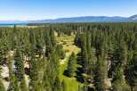 Nestled amidst a dense forest of towering pine trees, this property offers a serene and private retreat.