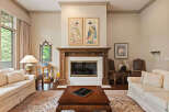 Step into this elegant living room, featuring a grand fireplace as the focal point, flanked by two exquisite Japanese-inspired artworks.