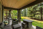 Enjoy outdoor living on this covered patio, perfect for relaxing or entertaining.
