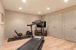 Transform your home into a personal fitness sanctuary with this dedicated gym space.