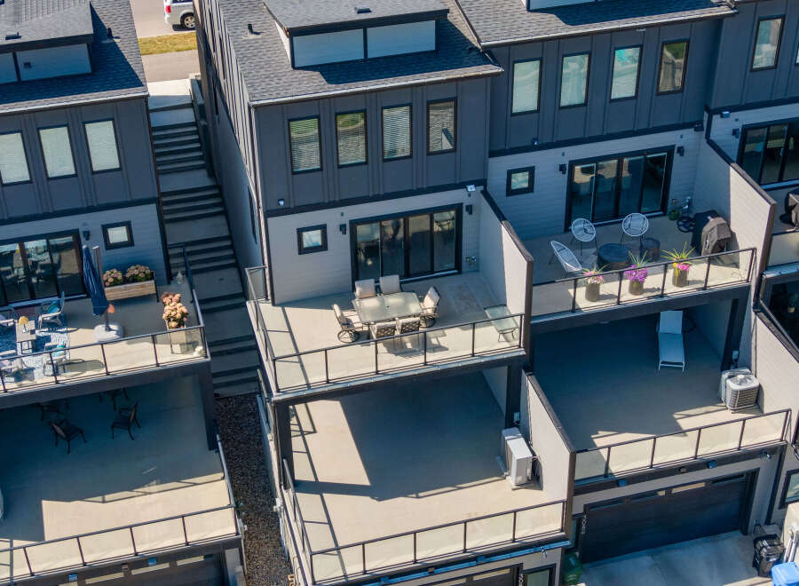 Experience modern urban living in this stunning townhouse featuring multiple levels of outdoor living space.