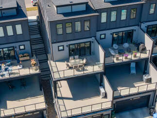 Experience modern urban living in this stunning townhouse featuring multiple levels of outdoor living space.