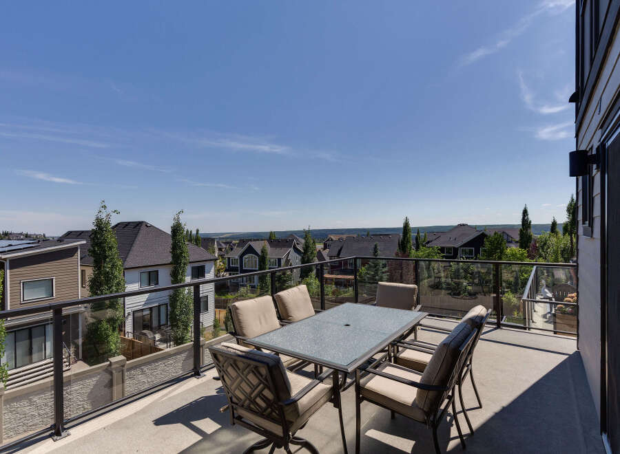 Enjoy breathtaking views from this spacious balcony, perfect for outdoor dining and entertaining.