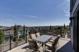 Enjoy breathtaking views from this spacious balcony, perfect for outdoor dining and entertaining.
